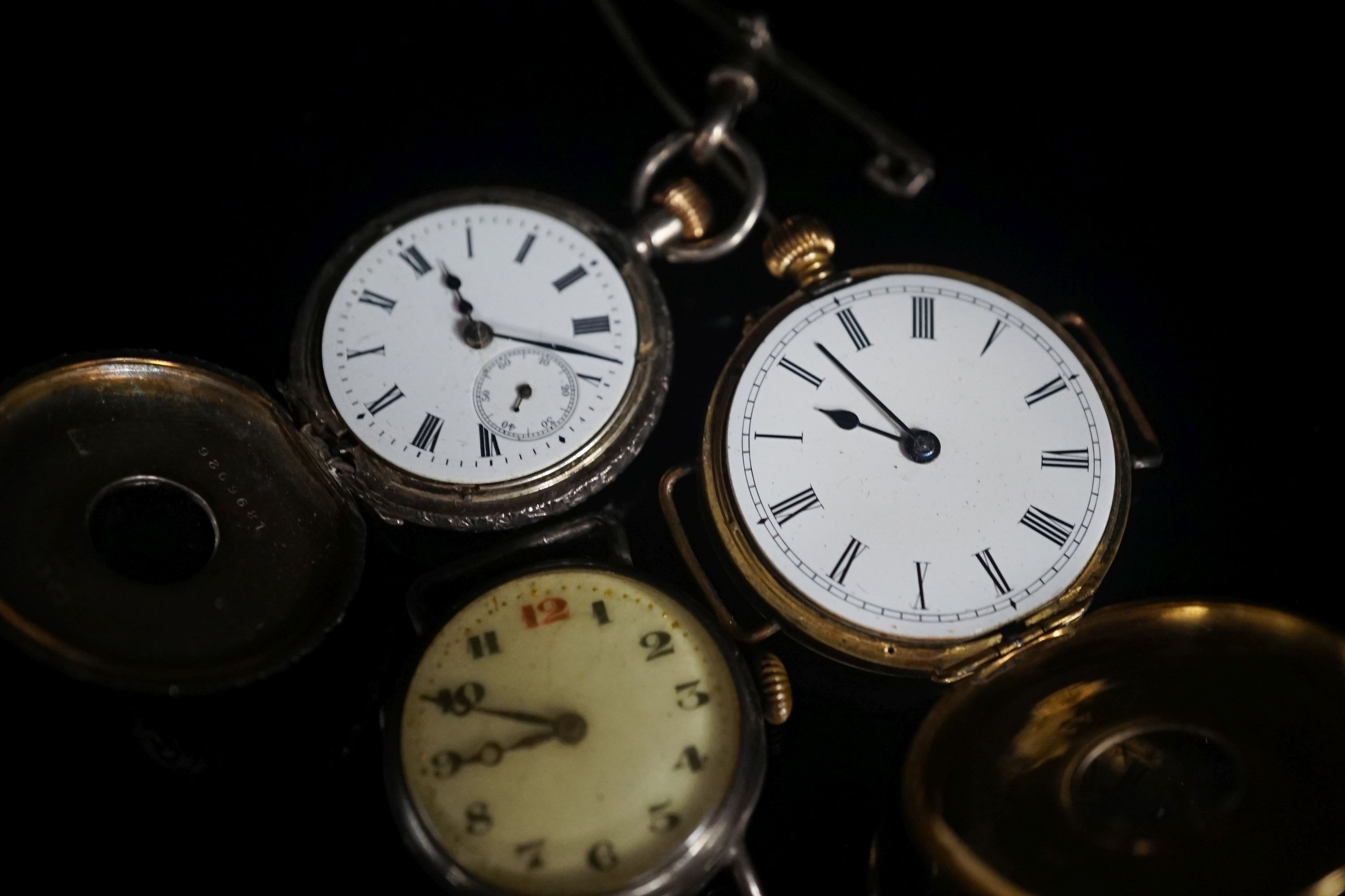 A gentleman's early 20th century continental 18k half hunter wrist watch, case diameter 33mm, gross weight 32.7 grams, together with two other silver watches.